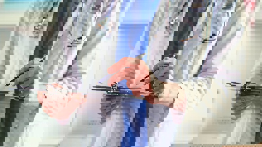 Medical doctor with clipboard and pen Adobe stock licenced (1)